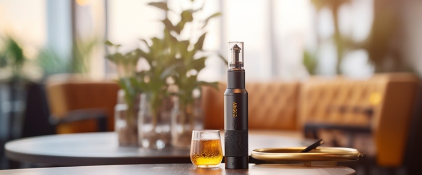 orange cbd e liquid and vape on table