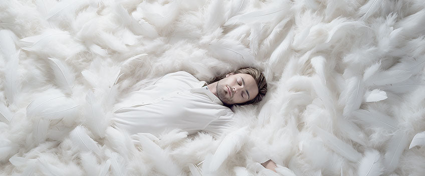 huile cbd homme dormant dans lit de plumes