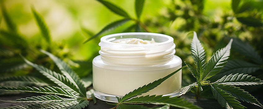 cbd cream on cannabis leafs